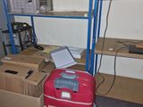 a red suitcase sitting on the floor in a room