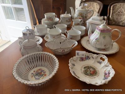 a table that has a lot of dishes and cups on it