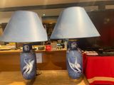 two lamps that are sitting on a table in a room