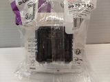 a small radio in a plastic bag on a table
