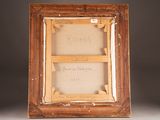 an old picture frame with a picture of a man and a woman on it