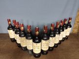a group of bottles of wine sitting on top of a wooden table