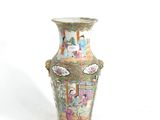 a vase that is sitting on a white surface