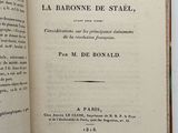 a book open on a table with a picture of a bird