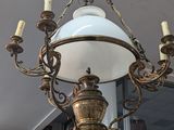 a chandelier hanging from the ceiling in a room