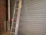 a ladder leaning against a wall in a garage