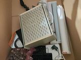 a box full of electronics and a keyboard in it