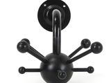 a black object that looks like a spider on a white background