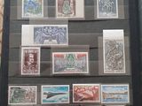 a display of stamps on display in a glass case