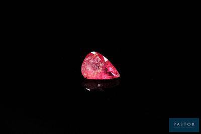 a pink diamond on a black background