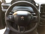 a steering wheel and dashboard of a car with a skull and crossbone on it