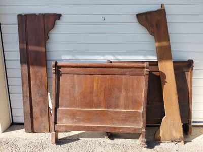 two pieces of wood leaning against a garage wall