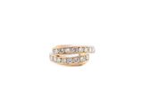 a close up of a gold ring with diamonds on a white background