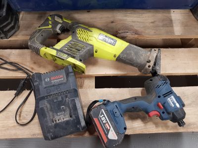 two electric tools that are sitting on a pallet