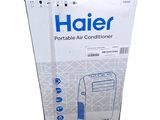 a box of haier portable air conditioner on a white background
