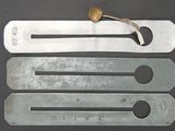 four different types of tools are shown on a black surface