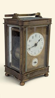 a small clock that is sitting on a table