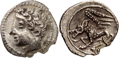 a silver coin with an image of a lion on it