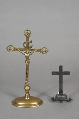 a small cross and a small crucif on a table