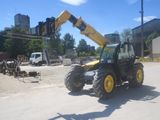 a construction vehicle that is parked on the side of the road