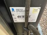 a close up of a metal pole with a label on it