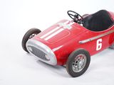 a red toy race car with a number on it