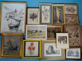 a lot of framed pictures on the wall of this room