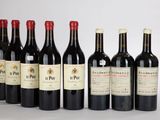 six bouteilles de vin rouge alignées sur une table