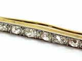 an image of a close up of a gold and diamond hair clip