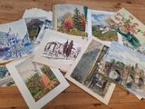many cards that are sitting on a wooden table