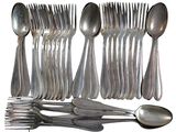 a lot of silver spoons and spoons on the table