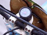 a close up of the handlebars on a blue bike