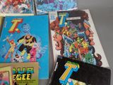 a lot of comic books sitting on a table