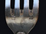 a fork that has a hole in the middle of it