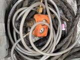 a bunch of hoses that are laying on the ground