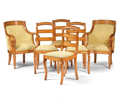 a group of chairs and a stool in a room