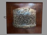 a picture of a metal plaque on a wall