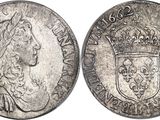 a silver coin with a crown on top of it