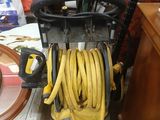 a hose that is attached to a cart in a room