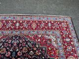 rug on the ground with a cat laying on it ' s side