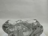a glass bowl that is sitting on a white surface