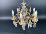 an image of a chandelier made of glass and brass