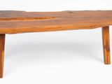 a wooden bench that is sitting on a white surface
