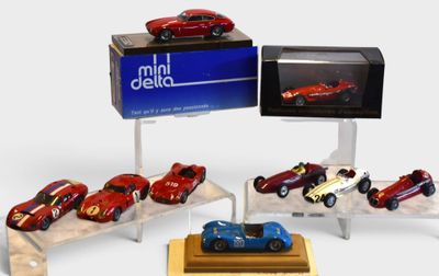 a lot of toy cars that are on display in a display case