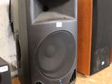 two speakers that are sitting on top of a table