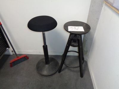 two stools sitting next to each other in a room