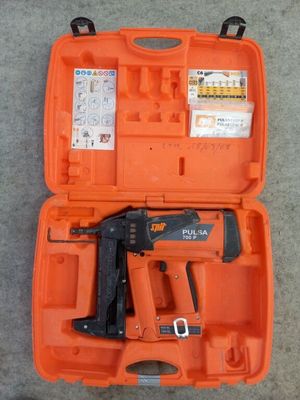 a close up of a tool kit in a case on the ground