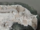 a close up of a rock with a lot of rocks on top of it