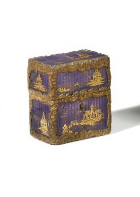 a purple and gold box sitting on top of a table