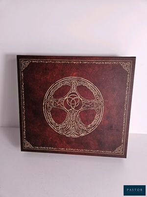 a brown leather book with a celtic design on it